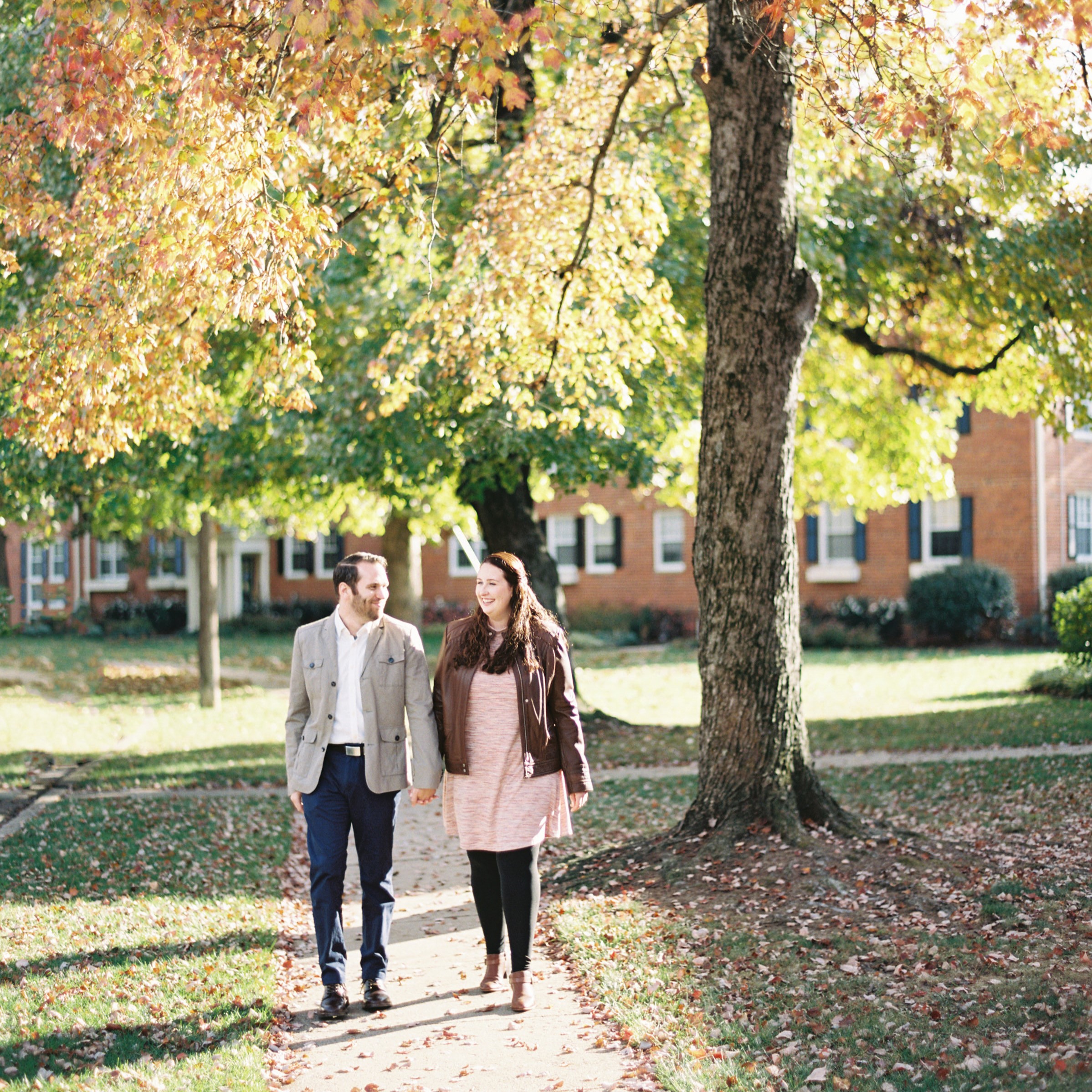old town engagement alexandria virginia autumn fall engagement couple walking red trees